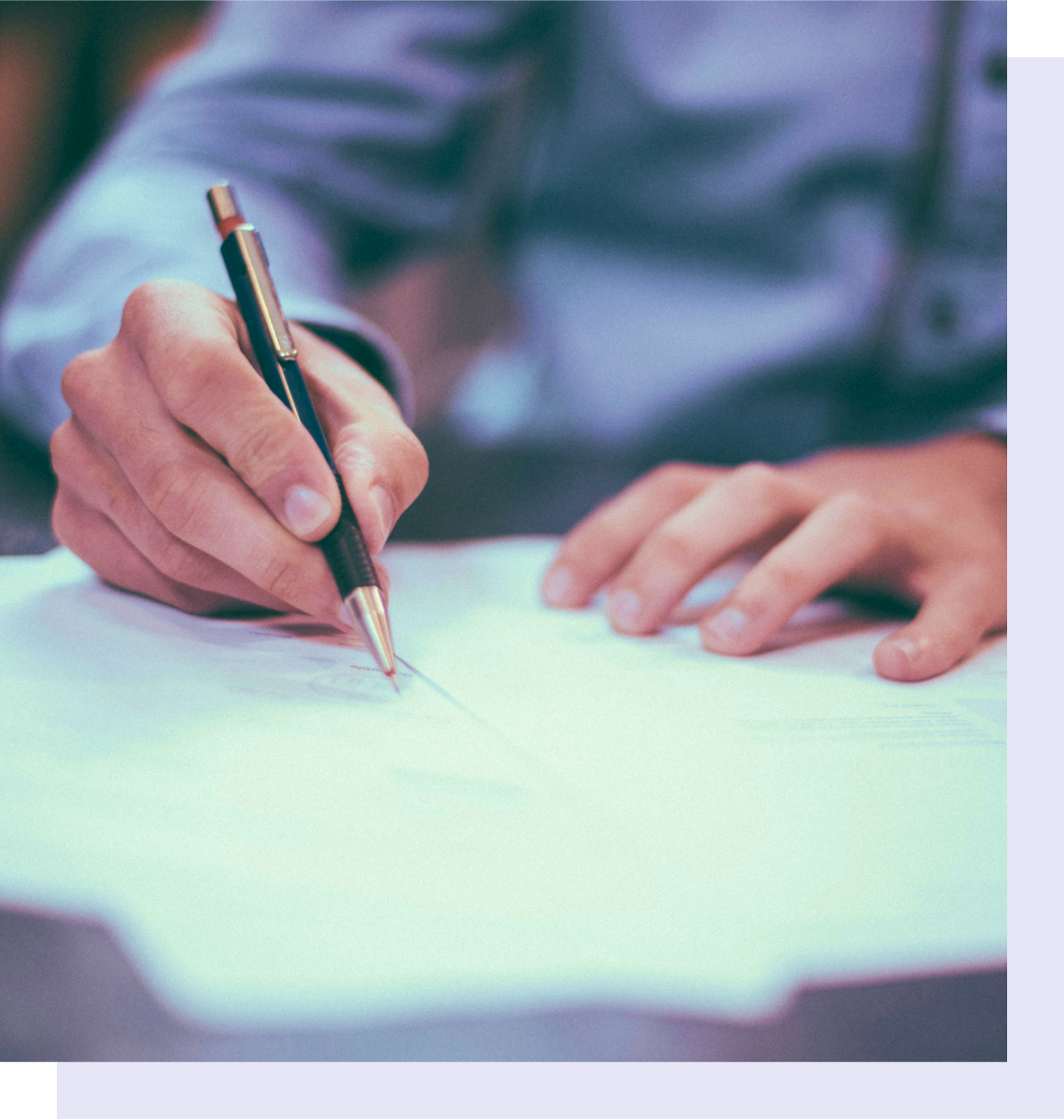 Person writing at a desk