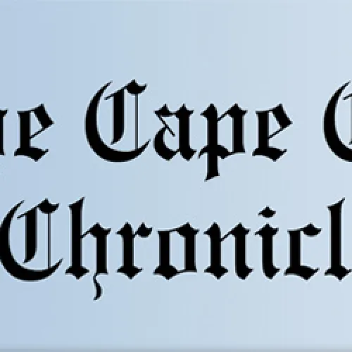 a logo with a lighthouse against a blue background that says The Cape Cod Chronicle. 