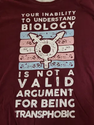 T-shirt reading, "Your inability to understand biology is not a valid argument for being transphobic."